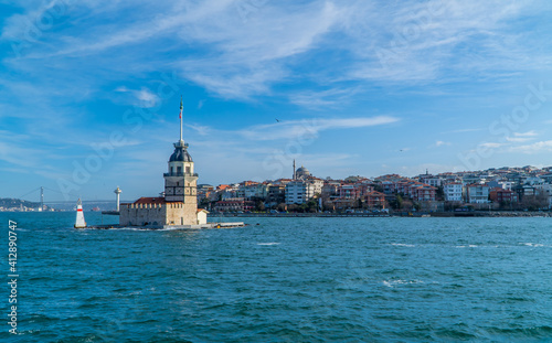 Beautiful panoramic view of the Maiden's Tower in Üsküdar on the Asian side of Istanbul, Turkey with buildings and a bridge in the background