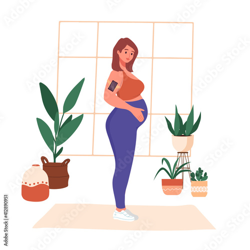 Young pregnant woman in sportswear doing yoga at home. Prenatal sport exercise, aerobic activity. Trendy scandinavian hygge interior, living room. Happy motherhood healthy lifestyle