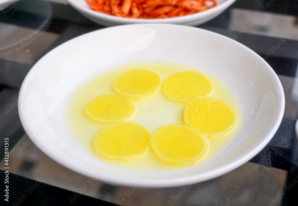 Selective focused traditional Korean side dish pickled radish. Selective focused traditional Korean side dish pickled radish.