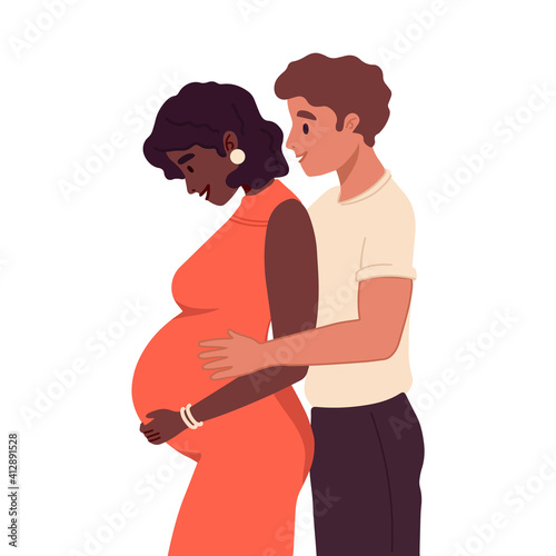 Young couple expecting baby. Happy family. Pregnant woman with a big belly and her husband hug together. Future parents, pregnancy, motherhood, parenthood concept. Multiethnic, multiracial couple