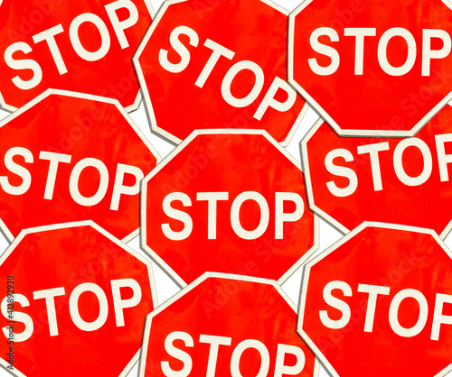 Stop signs on white background. Texture