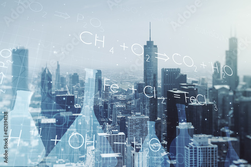Abstract virtual creative chemistry hologram on Chicago skyline background. Multiexposure