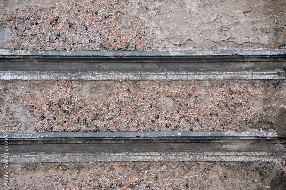 interior background with texture of old painted concrete wall with peeling plaster.