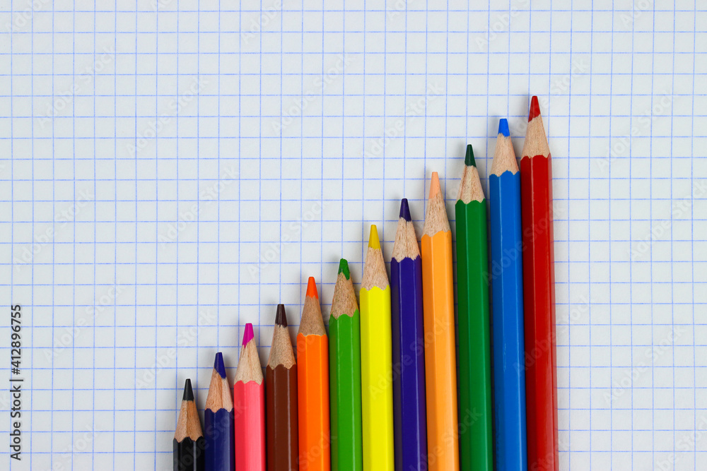 color pencils on notebook sheet close up color pencils on notebook sheet close up