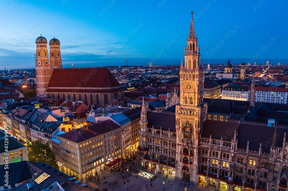 Aerial view of red roofs in old city at night, Munich, Germany