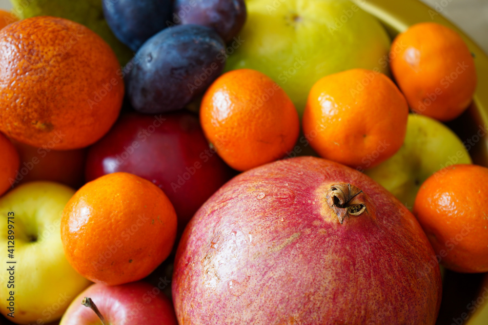 Big plate with lots of healthy fruits over paper background Big plate with lots of healthy fruits over paper background