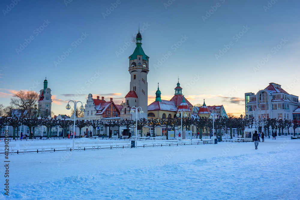 Beautiful sunset over the snowy pier (Molo) in Sopot at winter. Poland