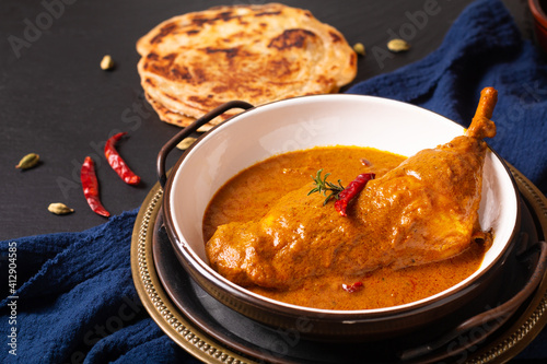 Food concept Homemade Tikka Masala Chicken or red curry on black background with copy space