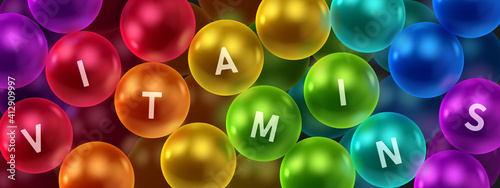 Banner with realistic colorfull balls, arranged according to the colors of the rainbow and letters vitamins. Abstract background. Vector illustration. 