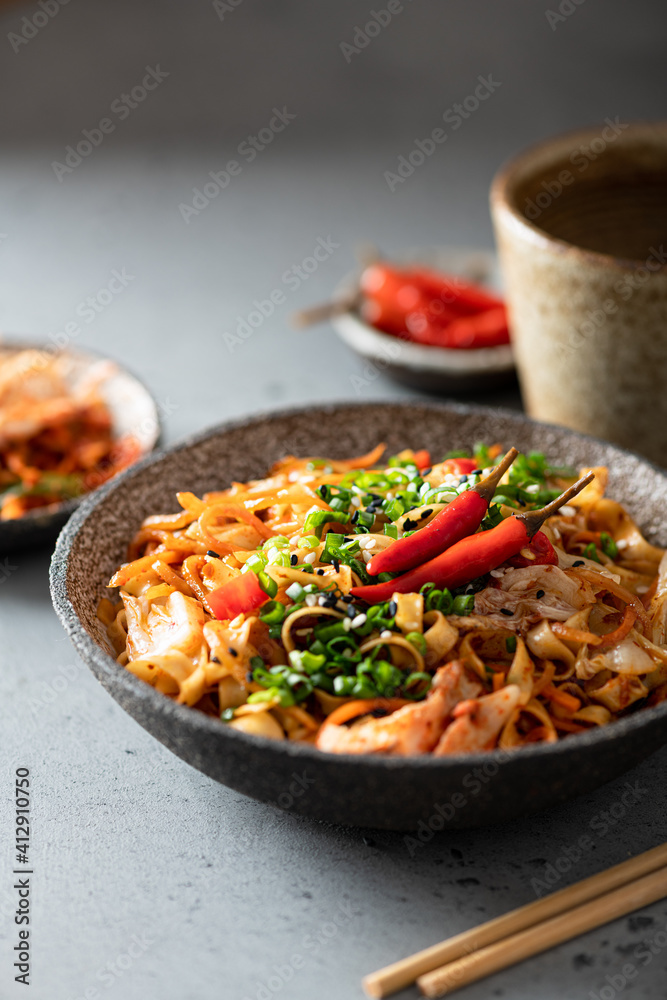 Asian food, wok noodle and vegetables in ceramic bowl, selective focus