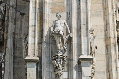 Detail of a sculpture on the facade of the Milan Cathedral, Italy