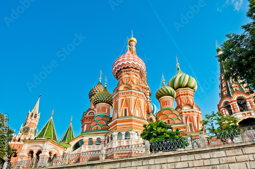 Spasskaya Tower and the Cathedral of Vasily the Blessed (Saint Basil's Cathedral) on Red Square. Sunny summer morning. Moscow. Russia