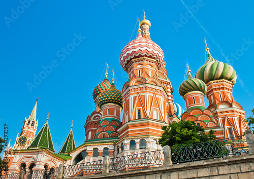 Spasskaya Tower and the Cathedral of Vasily the Blessed (Saint Basil's Cathedral) on Red Square. Sunny summer morning. Moscow. Russia