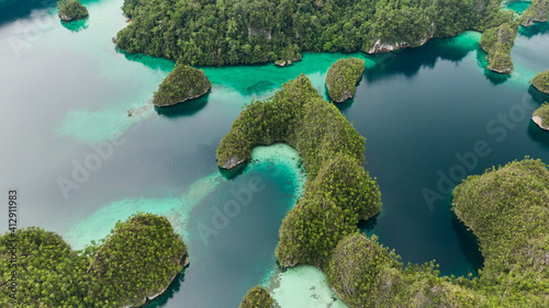 Aerial View Of Triton Bay In Raja Ampat Islands: Lagoon With Turquoise Water And Green Tropical Trees. Wide Angle Nature: Pacific Ocean And Beautiful Landscape In Papua, Indonesia.