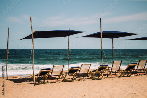 beach chairs and umbrellas