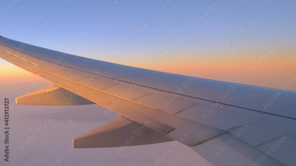 View From Airplane Window at Beautiful Sunrise Or Sunset in 4k