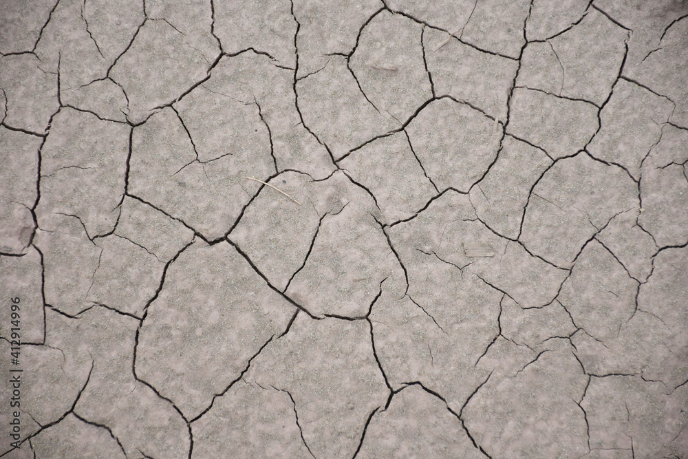 Top view cracked patterns of soil ground texture for background , nature drought Top view cracked patterns of soil ground texture for background , nature drought