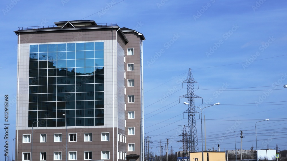 modern building of the Republican archive with a mirrored facade against the background of power lines on the outskirts of the urban space modern building of the Republican archive with a mirrored facade against the background of power lines on the outskirts of the urban space
