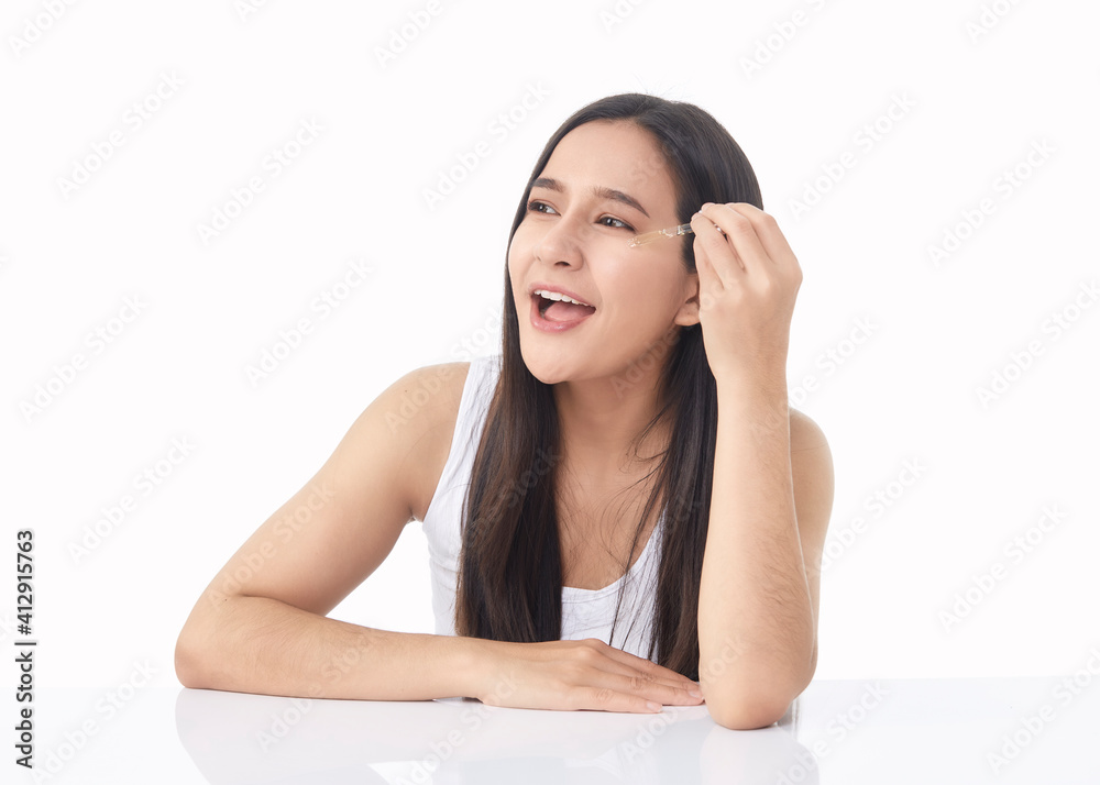 woman holding pipette with a cosmetic oil woman holding pipette with a cosmetic oil