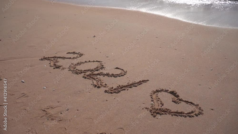 2021 year and romantic love heart sign hand written sandy beach outdoors seascape video clip 2021 year and romantic love heart sign hand written sandy beach outdoors seascape video clip