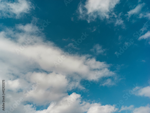 Texture of a blue sky with white clouds 