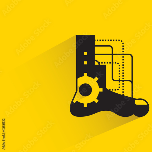 robotic foot with drop shadow yellow background