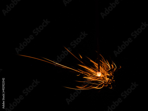 burning sparkler on black background