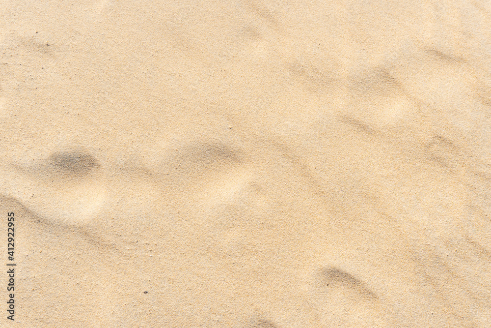 Fine beach sand in the summer sun Fine beach sand in the summer sun