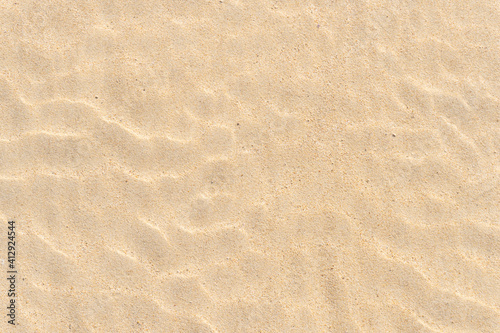 Fine beach sand in the summer sun photo