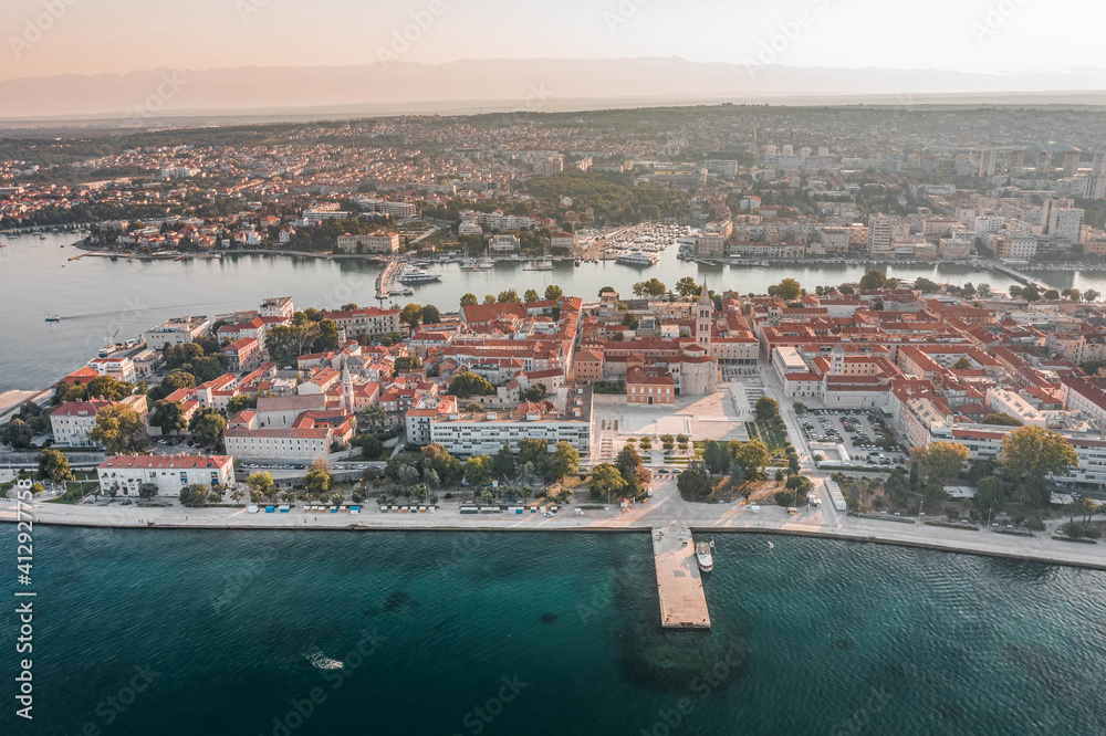 Aerial drone shot of pier near old town square on Zadar peninsula in sunrise in Croatia
