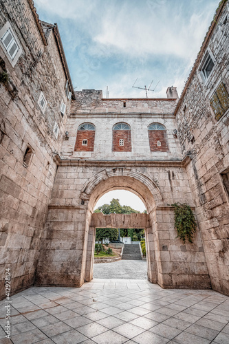 Stone facade of golden gate entrance to Diocletian Palace in Split Croatia © Davidzfr