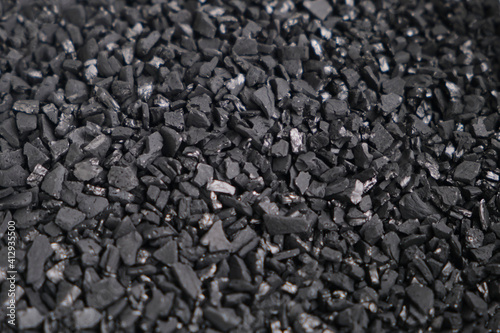Fotografie Close-up of black charcoal. Texture background.