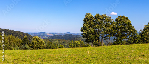 Fototapeta Naklejka Na Ścianę i Meble -  Panoramic view of south-eastern Beskidy Mountains seen from path to Leskowiec peak from Targoszow village on southern slope of Little Beskids in Lesser Poland