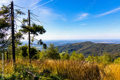 Fototapeta Naklejka Na Ścianę i Meble -  Panoramic view of northern Beskidy mountains with Gancarz peak seen from Leskowiec peak in Little Beskids mountains near Andrychow in Lesser Poland