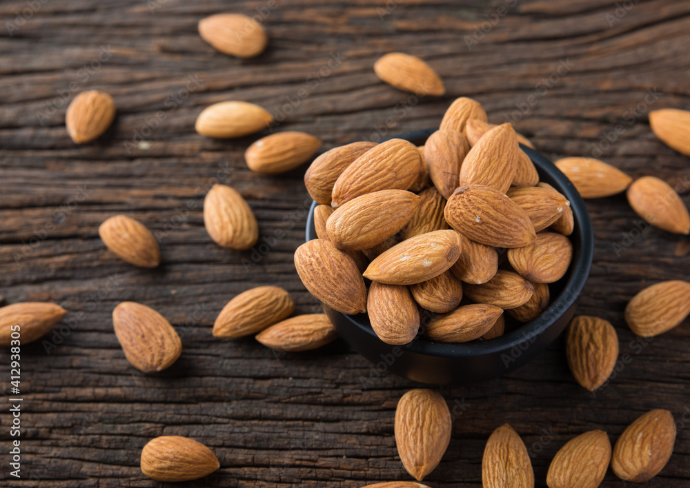 Almond in a Bowl on Wooden Background Almond in a Bowl on Wooden Background