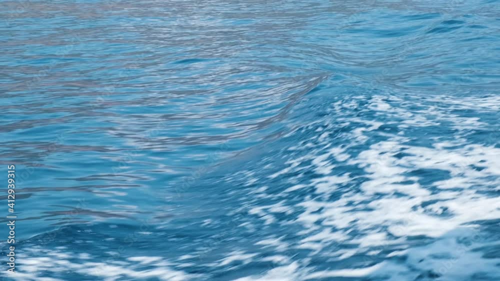 Sea Surface Blue Water Waves. Close Up Shot. Sunny Day on Vacation. Relaxing Scene. Holiday Concept for Relaxing. Useful Background Shot. 4K Resolution Slow Motion. Sea Surface Blue Water Waves. Close Up Shot. Sunny Day on Vacation. Relaxing Scene. Holiday Concept for Relaxing. Useful Background Shot. 4K Resolution Slow Motion.