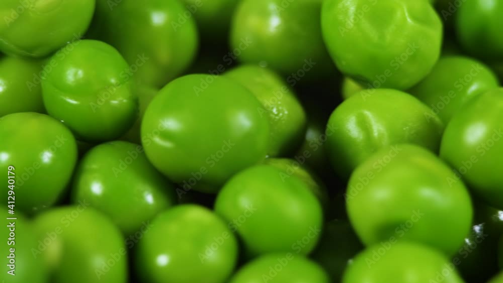 Close Up Green Peas Background Rotating. Macro Shot Fresh Organic Green Peas. Vegetable Harvest Healthy Eating. Beautiful Texture Close-up of Fresh Green Peas. Healthy Vegetarian food. Close Up Green Peas Background Rotating. Macro Shot Fresh Organic Green Peas. Vegetable Harvest Healthy Eating. Beautiful Texture Close-up of Fresh Green Peas. Healthy Vegetarian food.