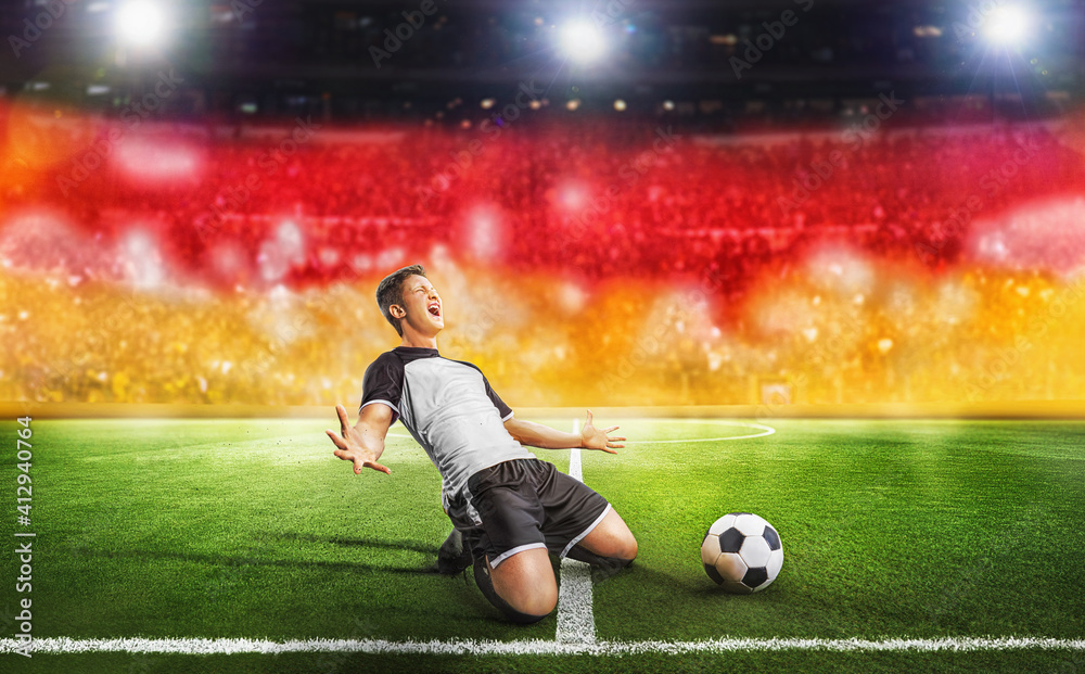 Ball on the green field in soccer stadium. Professional german Soccer  Player Does Knee Slide Celebrates Awesome Victory after Scoring a Goa Stock  Photo | Adobe Stock