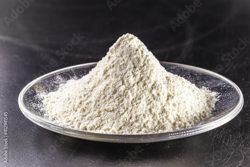 Pile of calcium sulfate on white background, known as micronized alabaster or micronized plaster photo