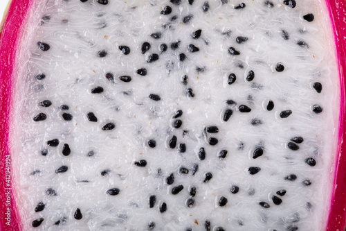 Background with dragon fruit seeds, closeup