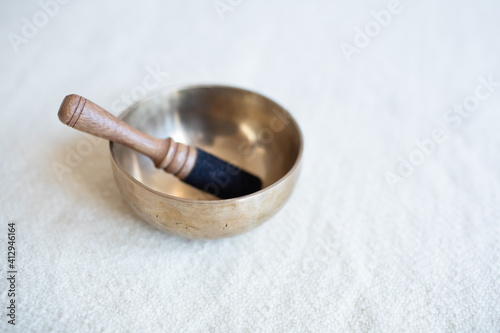 Singing bowl or Tibetan bowl and wooden mallet or stick for meditation, mindfulness, sound healing, relaxation. 