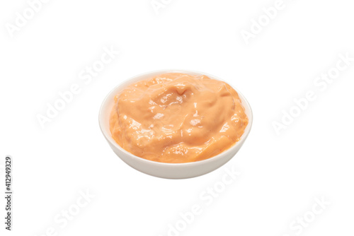 Sauce in a bowl isolated on white.