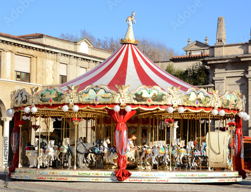 Merry carousel for children in the center of Bergamo