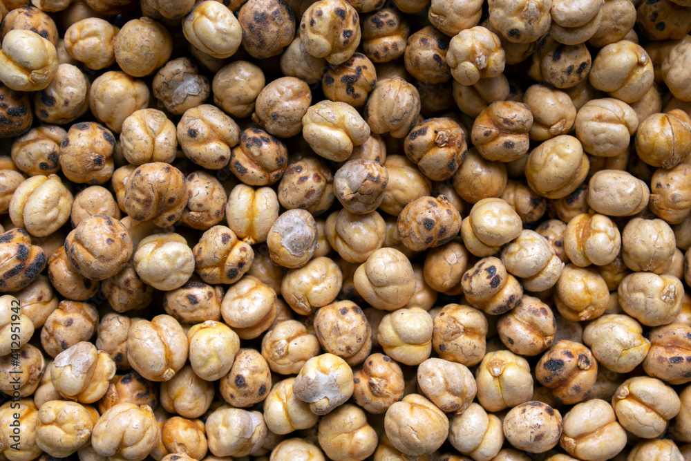 close-up on a pile of roasted chickpeas (greek stragalia ), a superfood that is sold as close-up on a pile of roasted chickpeas (greek stragalia ), a superfood that is sold as