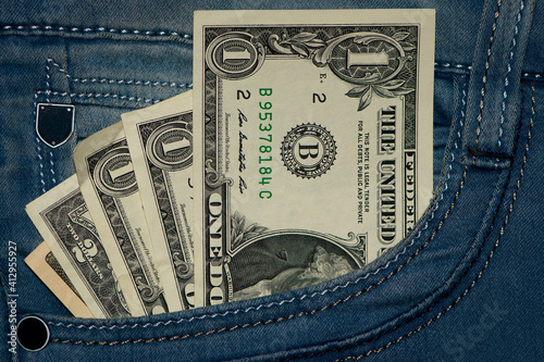 dollar banknotes. money in your pocket. paper money, currency, cash. close-up. finance, payments, trade, financial transactions concepts, crisis. One dollar banknote in jeans pocket.