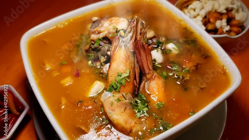 Encebollado, comida tradicional del Ecuador es delicioso. Sopa de albacora con langostino  photo