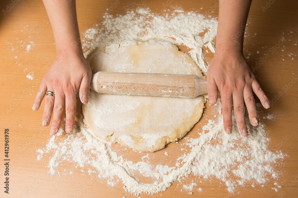 Female hands making dough for baking or bread. Female hands making dough for baking or bread.