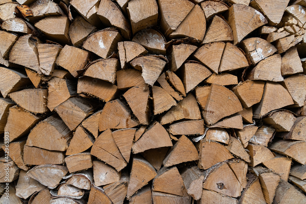 firewood stacked in a woodpile. Aged timber. Pattern firewood stacked in a woodpile. Aged timber. Pattern