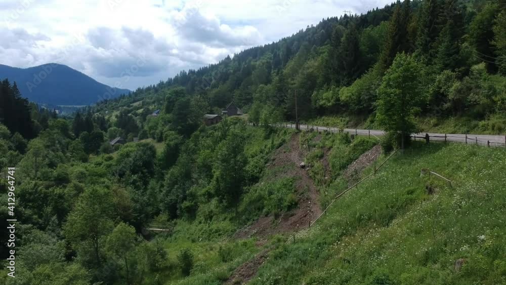 Drone view of the mountains and the village surrounded by forest. Ukraine Carpathians Drone view of the mountains and the village surrounded by forest. Ukraine Carpathians