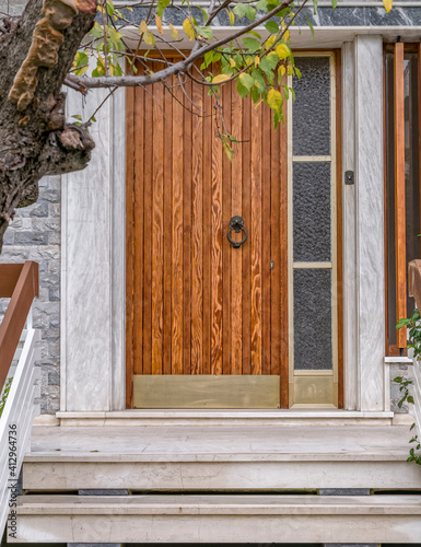 contemporary house main entrance natural wood door and side transom window